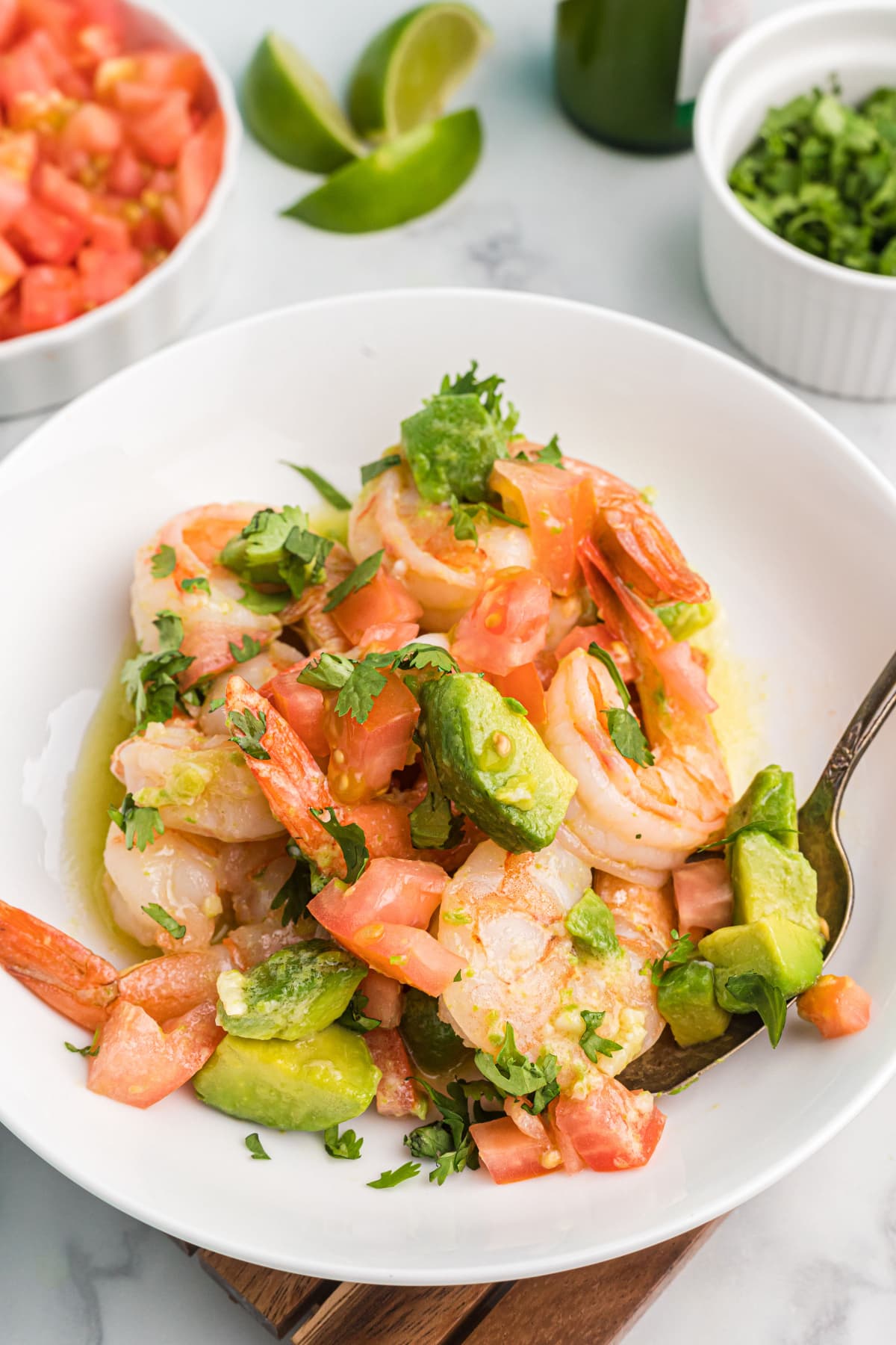 shrimp mezcal on a plate with a fork