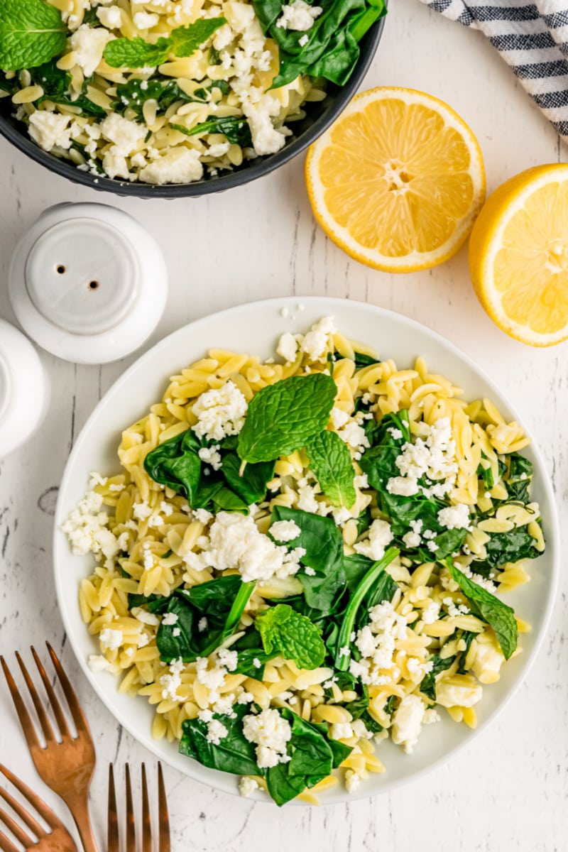spinach with orzo and feta in a bowl