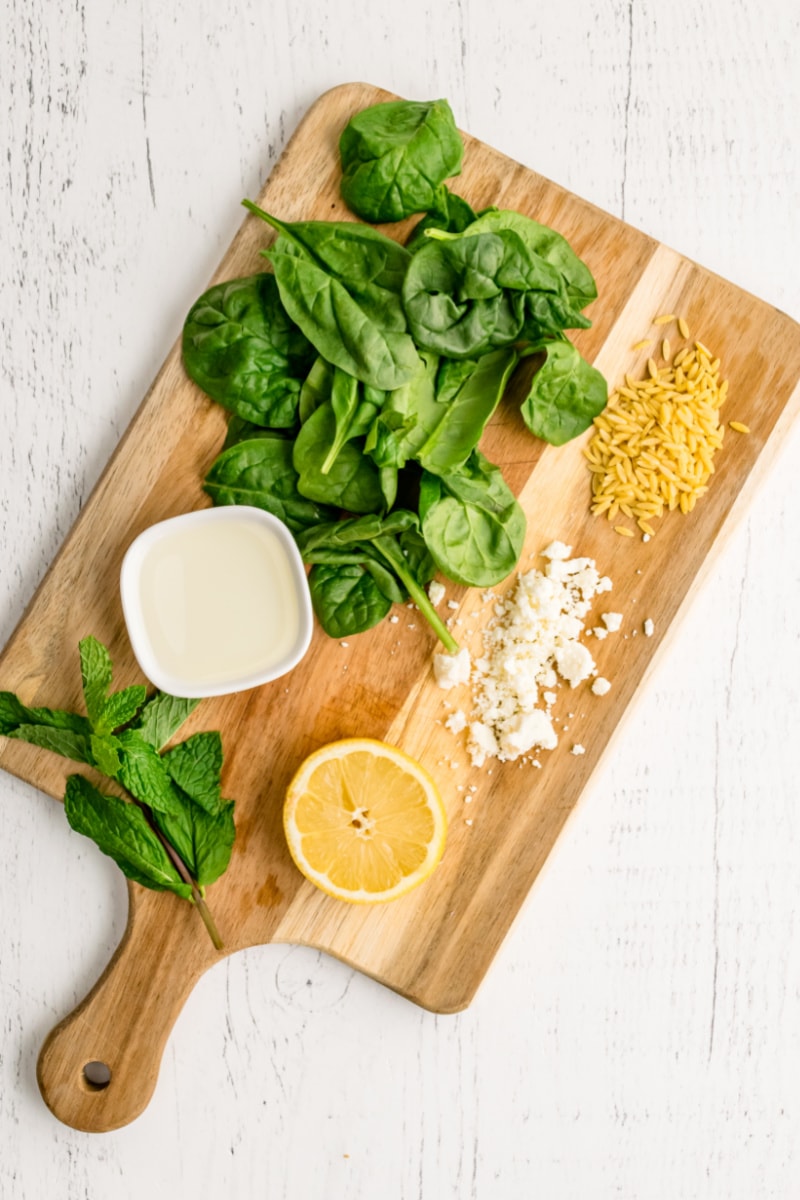 ingredients displayed for making spinach with orzo and feta