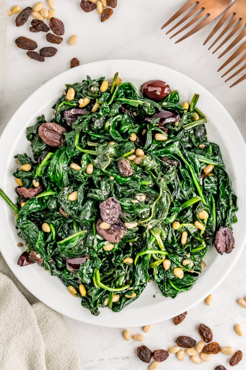 Spinach with Olives, Raisins and Pine Nuts recipe from RecipeGirl.com #spinach #olives #raisins #pinenuts #recipe #RecipeGirl spinach with olives raisins and pine nuts