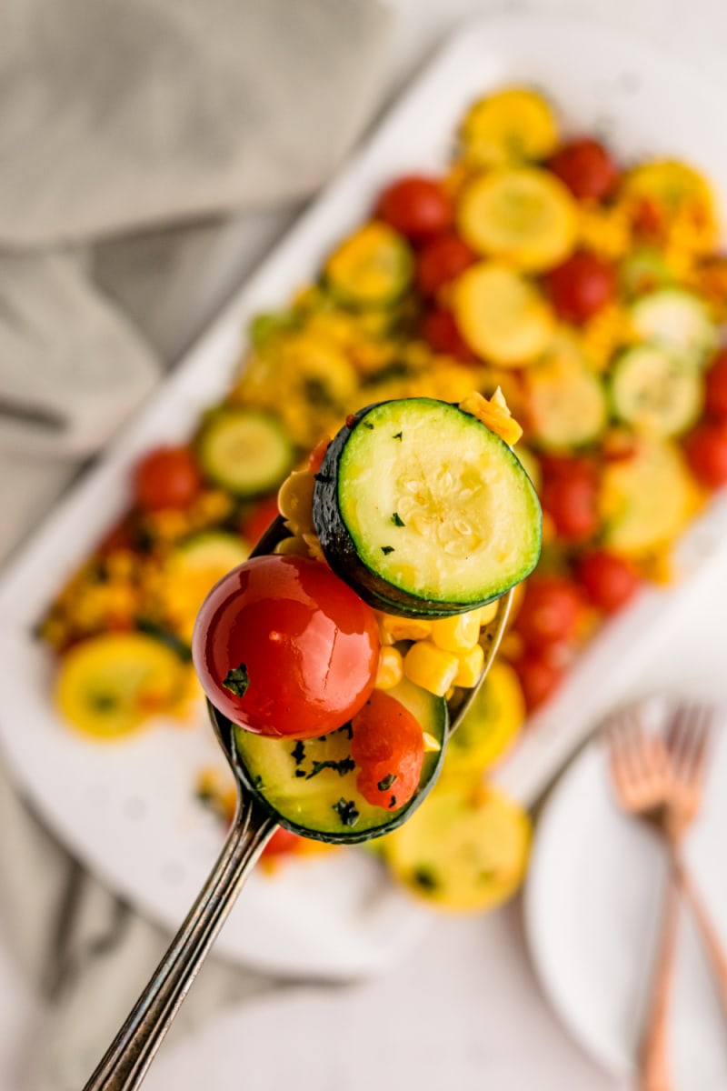 forkful of summer squash and cherry tomatoes