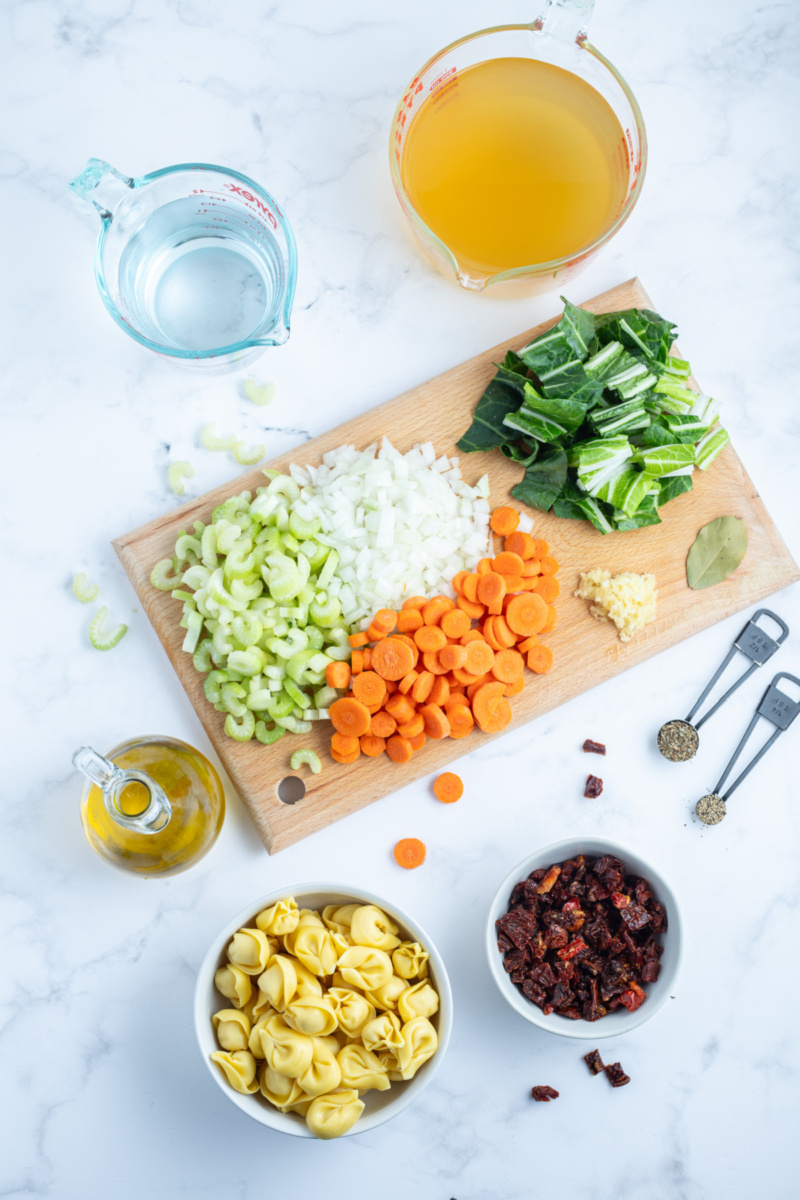 ingredients displayed for making sundried tomato tortellini soup