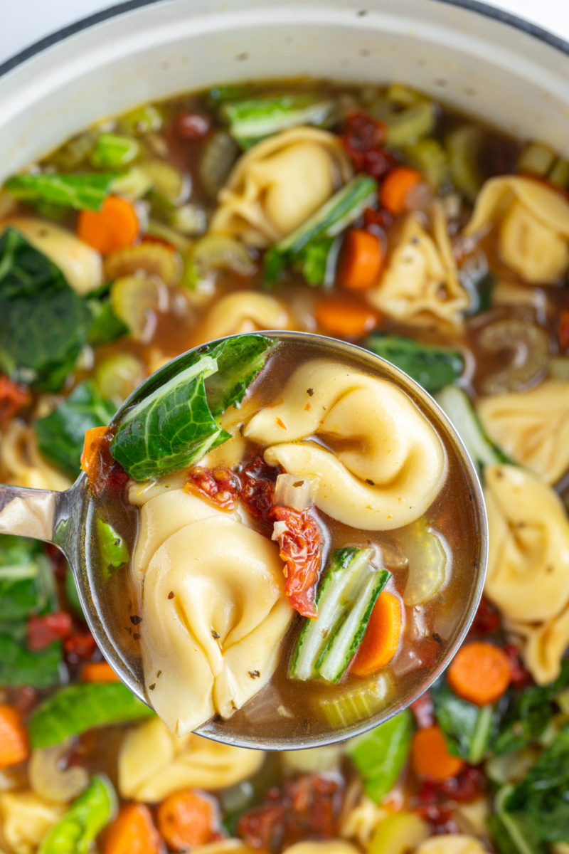 ladle full of sundried tomato tortellini soup