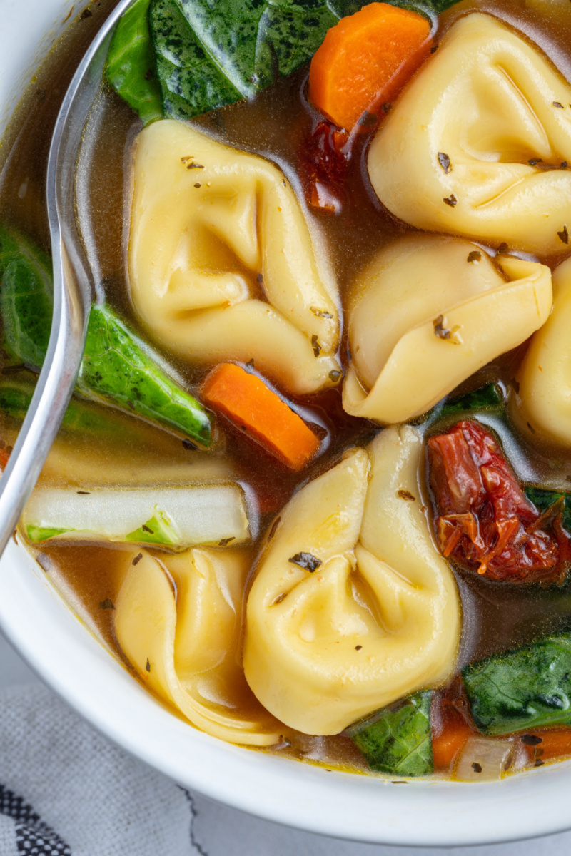 close up of bowl of sundried tomato tortellini soup