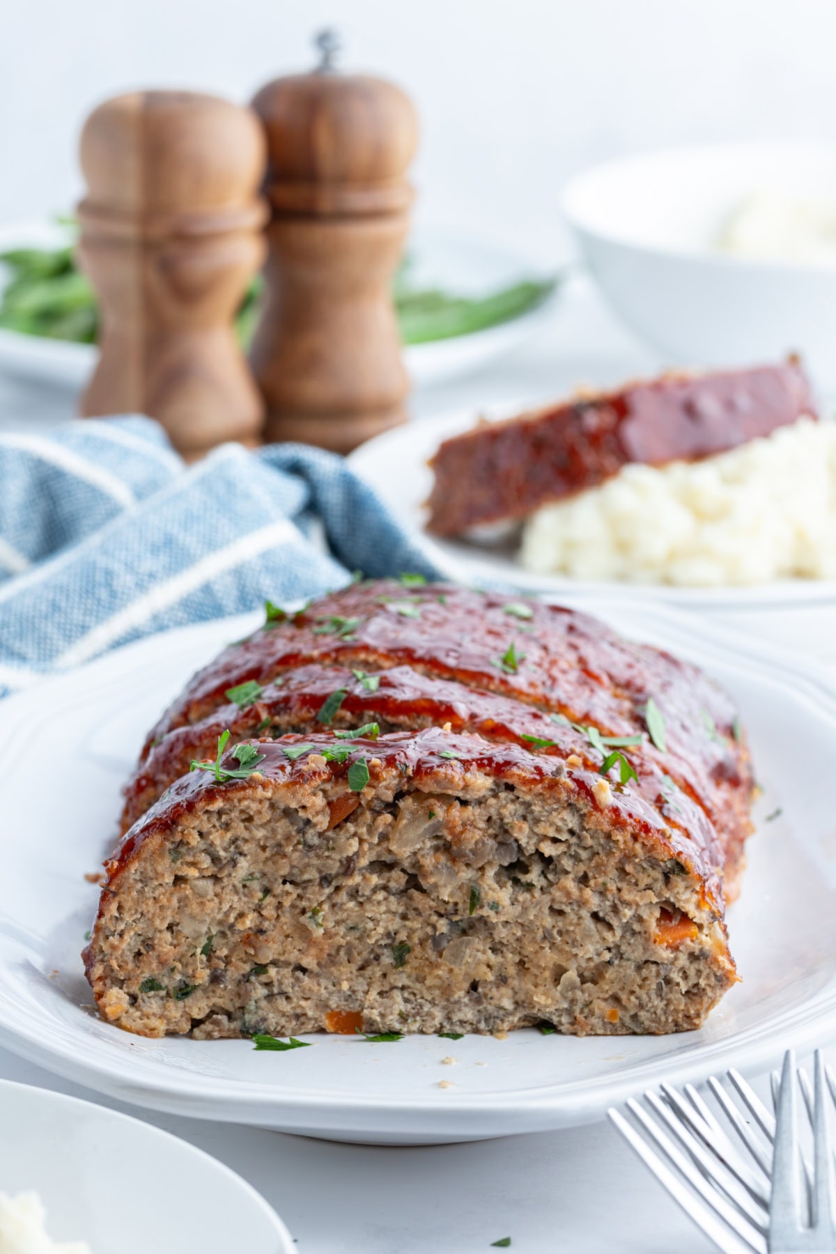 Moist Ground Turkey Meatloaf made with lean turkey, veggies, and BBQ sauce for flavor. Healthy, high protein, and never dry. Easy weeknight dinner recipe. ground turkey meatloaf on platter