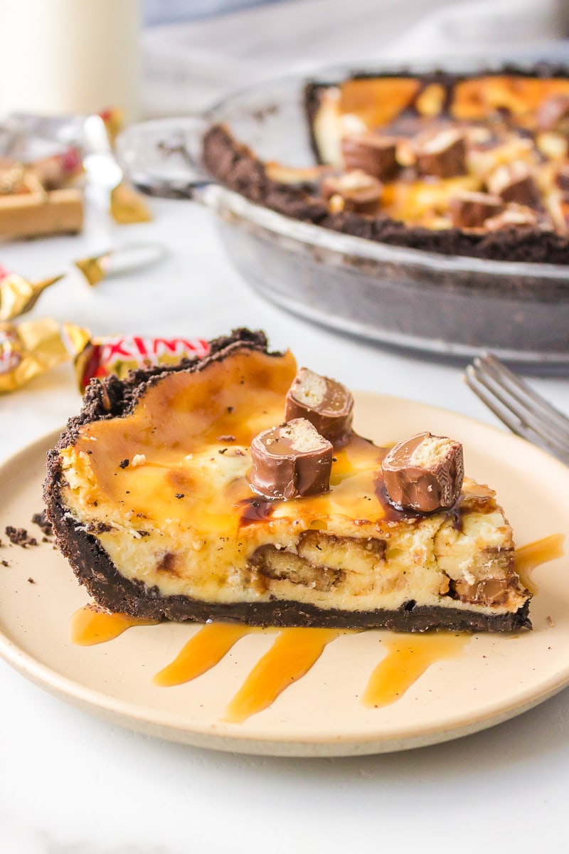 slice of twix cheesecake pie