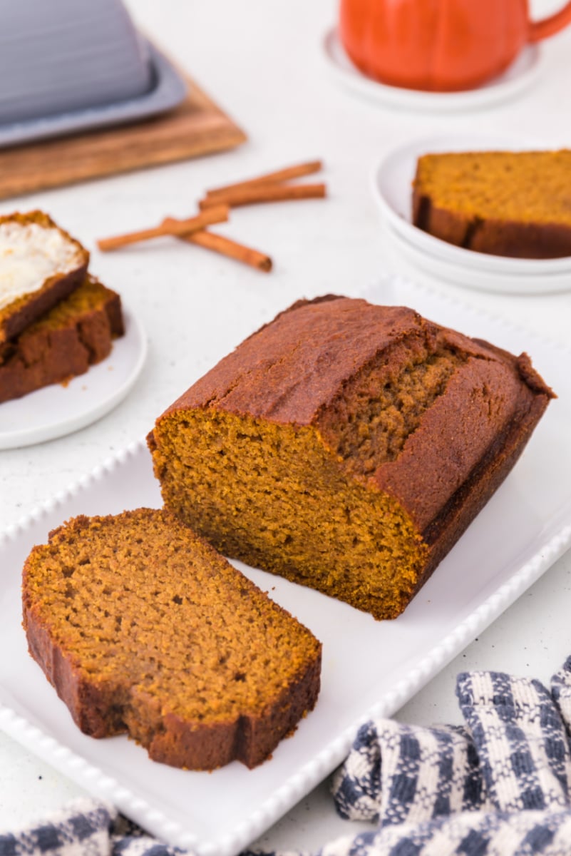 loaf of pumpkin bread cut open to slice.