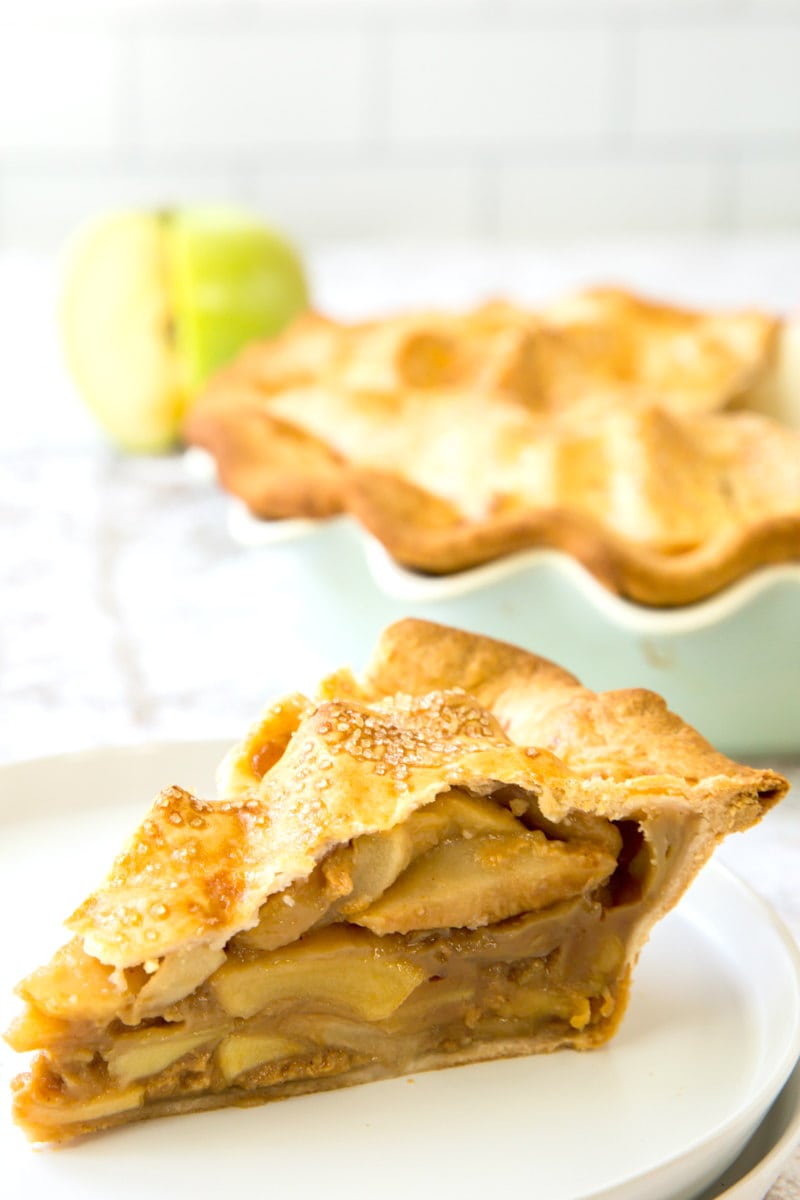 slice of dulce de leche apple pie on white plate