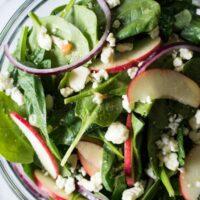 autumn apple and spinach salad in a bowl