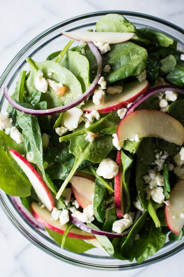 Autumn Apple and Spinach Salad recipe from RecipeGirl.com #autumn #apple #spinach #salad #recipe #RecipeGirl Autumn Apple and Spinach Salad in a bowl