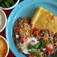 beans and cornbread in a blue bowl