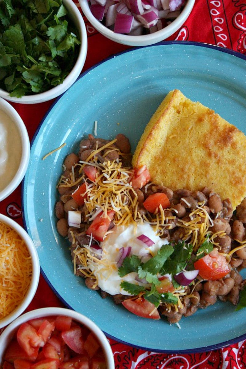 beans and cornbread in a blue bowl