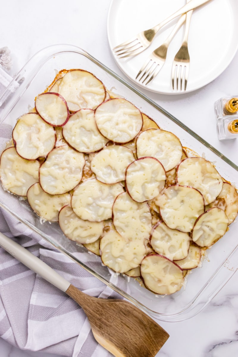 beer baked scalloped potatoes in pan