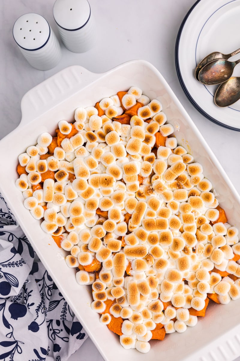 caramelized yams with marshmallows in white baking dish