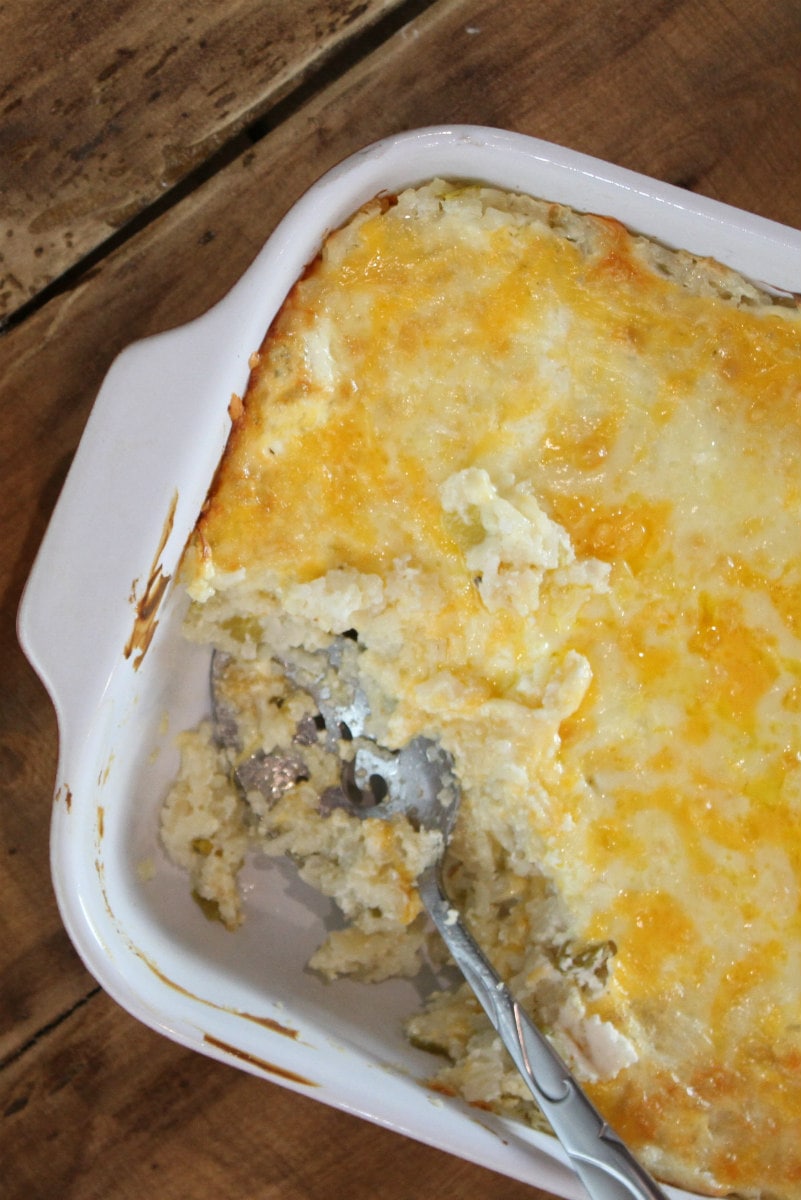 Chile Cheese Rice recipe from RecipeGirl.com #chile #cheese #rice #casserole #side #dish #sidedish #recipe #mexican #RecipeGirl Spooning out Chile Cheese Rice