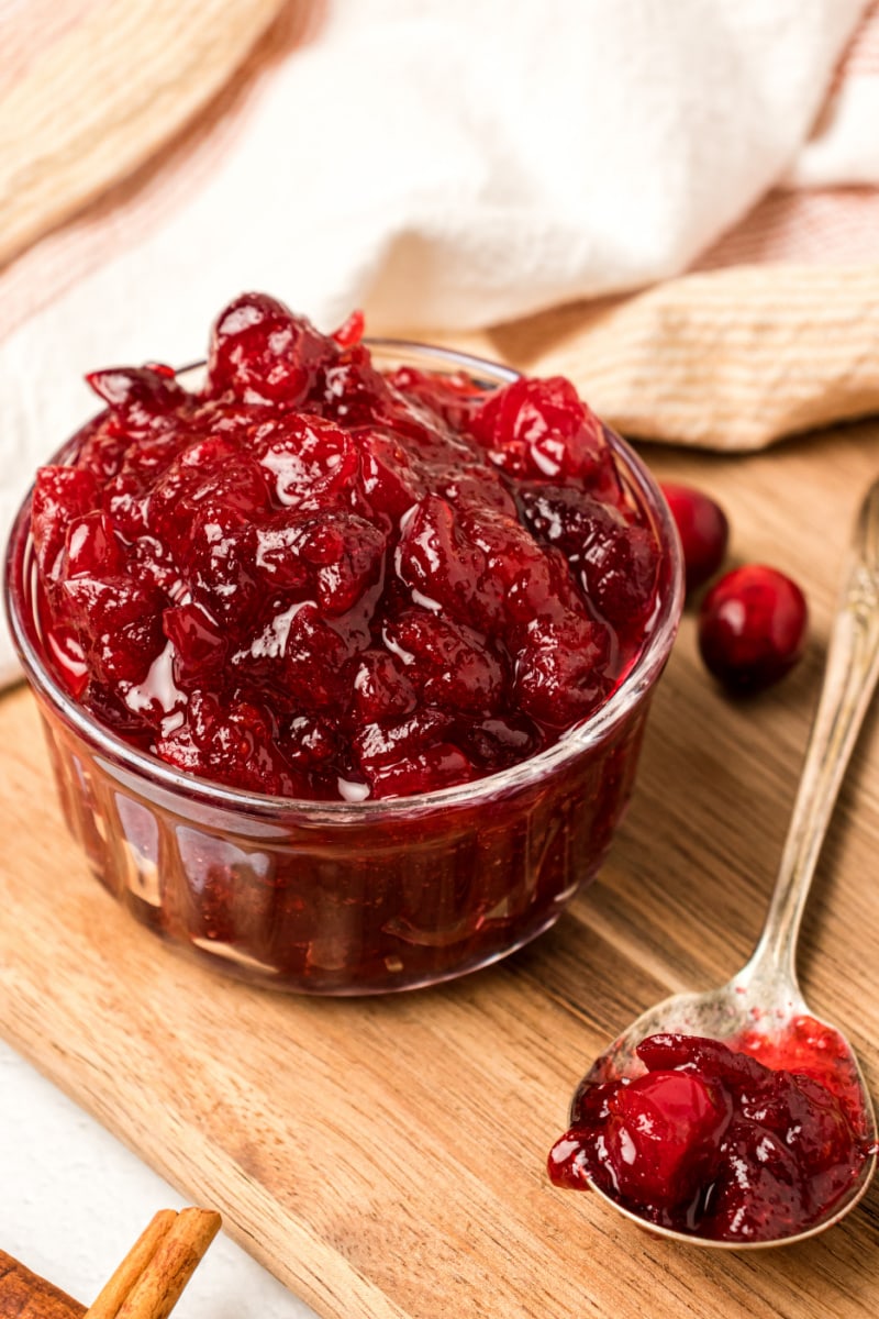 bowl of cinnamon cranberry sauce with spoonful on side