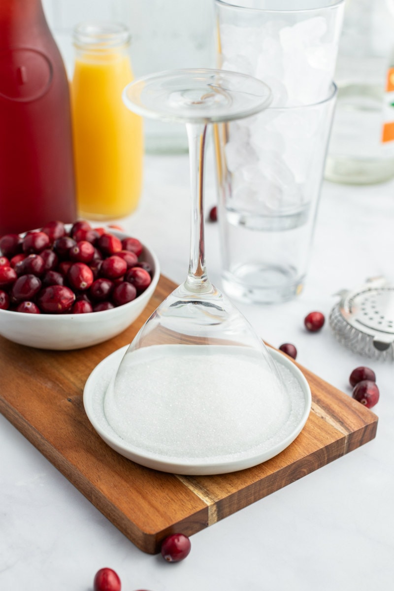 dipping rim of glass into sugar