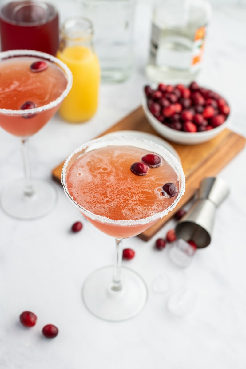 cranberry margaritas in glasses with cranberries floating