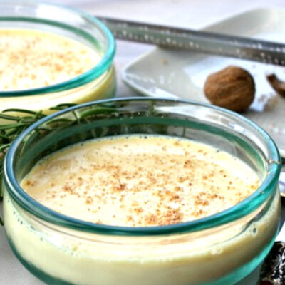 eggnog custard with nutmeg in glass dish