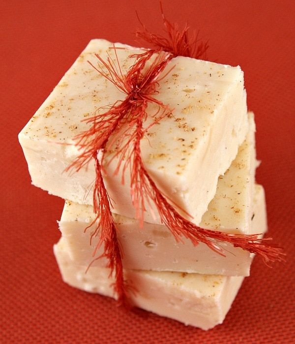 three pieces of eggnog fudge wrapped in a bow