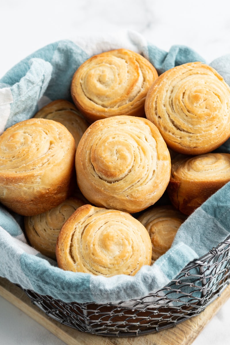 flaky dinner rolls in a basket