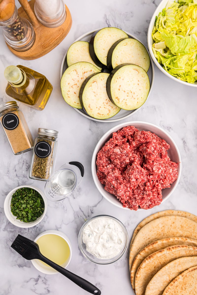 ingredients displayed for making greek inspired burgers