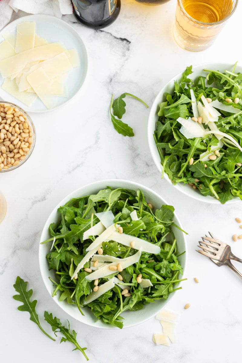 salad in two white bowls