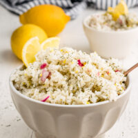 lemon dill rice in a bowl with lemons