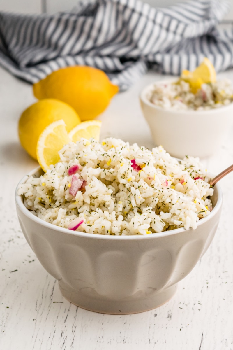 lemon dill rice in a bowl with lemons