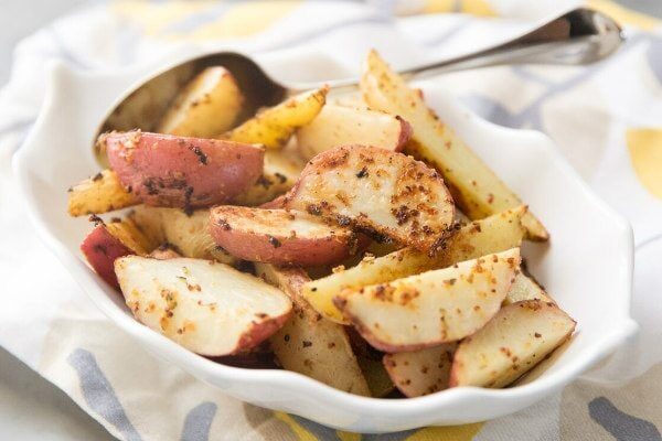 Mustard Roasted Potatoes recipe from RecipeGirl.com #mustard #roasted #potatoes #recipe #RecipeGirl Mustard Roasted Potatoes in a dish