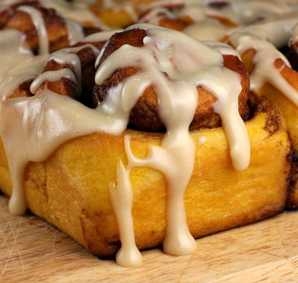 pumpkin cinnamon roll topped with maple icing