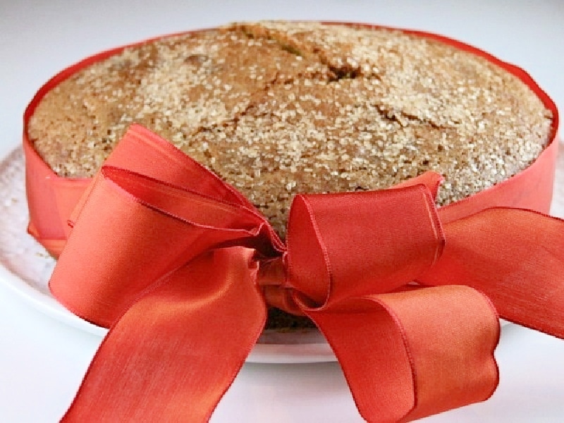 rosemary polenta pumpkin spice cake with a ribbon around it