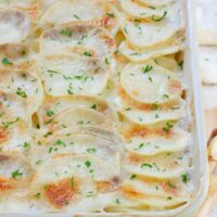 scalloped garlic potatoes in a casserole dish