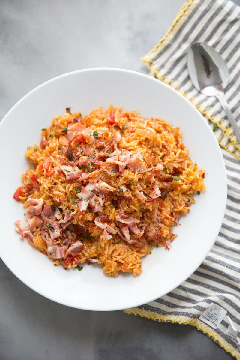 Easy Spanish Rice recipe from RecipeGirl.com #easy #spanish #rice #recipe #bacon #RecipeGirl Spanish Rice in a white bowl