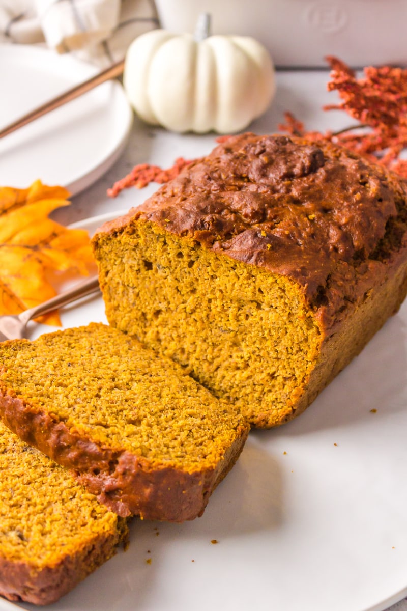 loaf of spicy whole wheat pumpkin banana bread sliced open