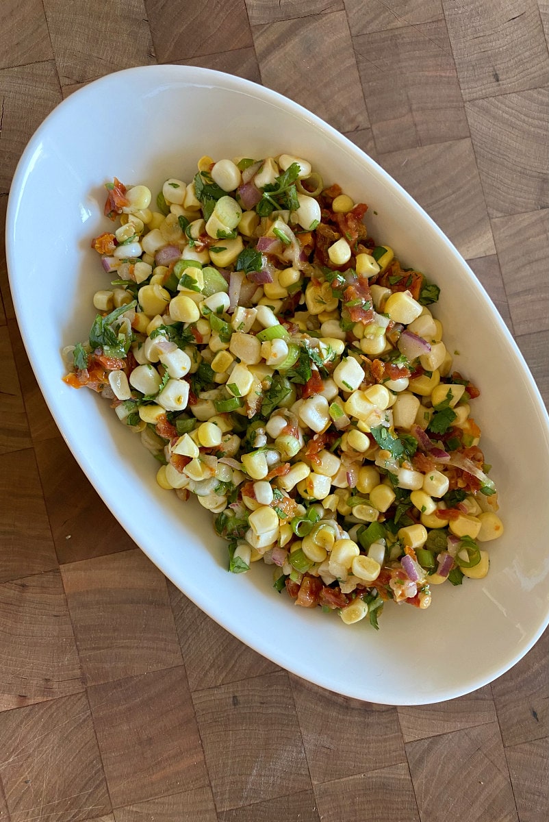 fresh corn and sun-dried tomato salsa in a white bowl