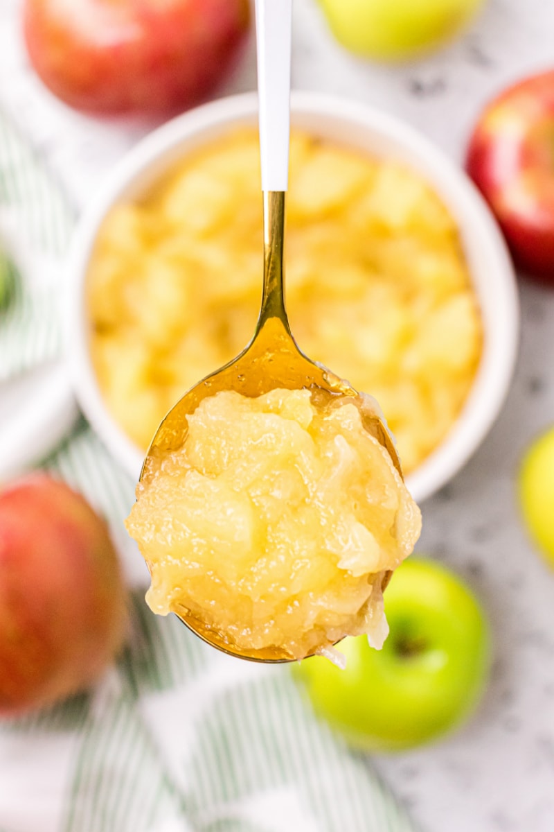 spooning out three apple applesauce