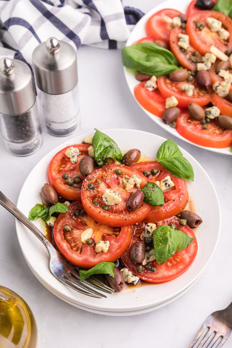 tomato caper and blue cheese salad on a plate