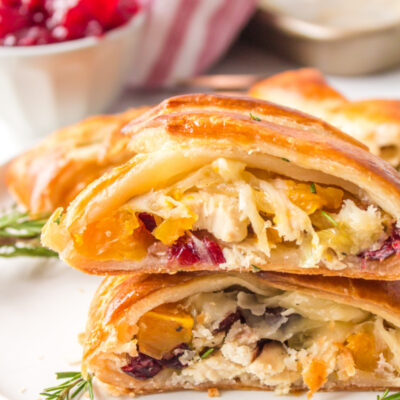 sliced turkey cranberry strudel stacked on a plate