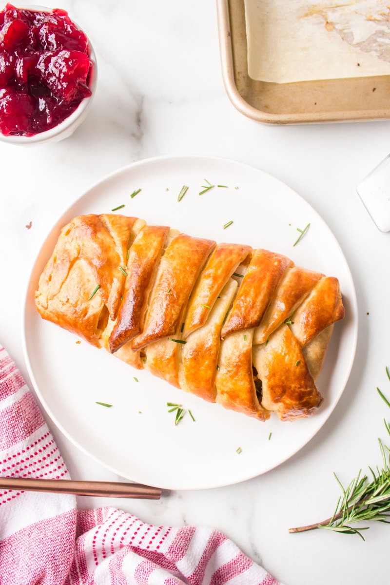 turkey cranberry strudel on a white platter