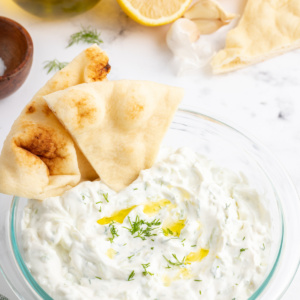 tzatziki sauce in a bowl with pita chips