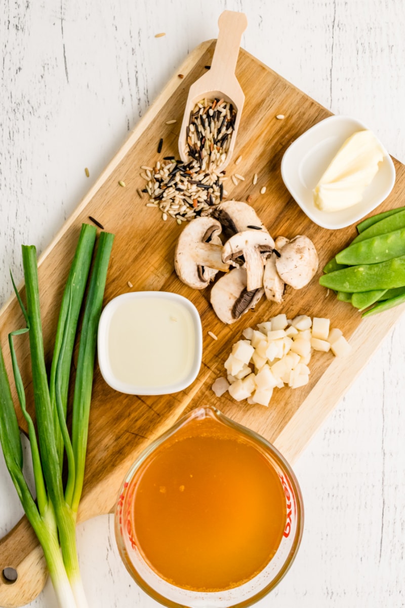 ingredients displayed for making wild rice with snow peas and mushrooms