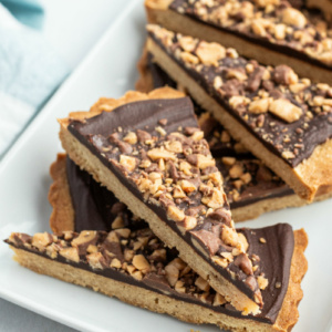 chocolate toffee wedges on a white platter