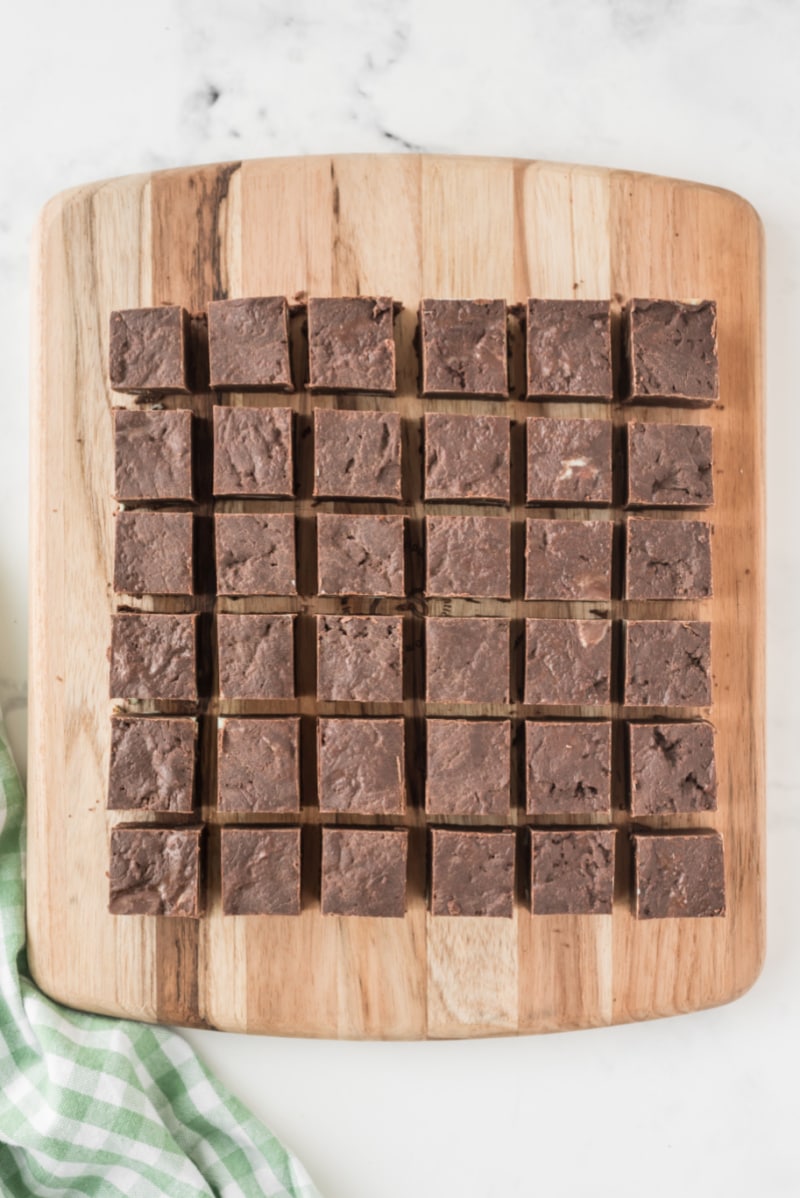 mint fudge cut into pieces on a cutting board