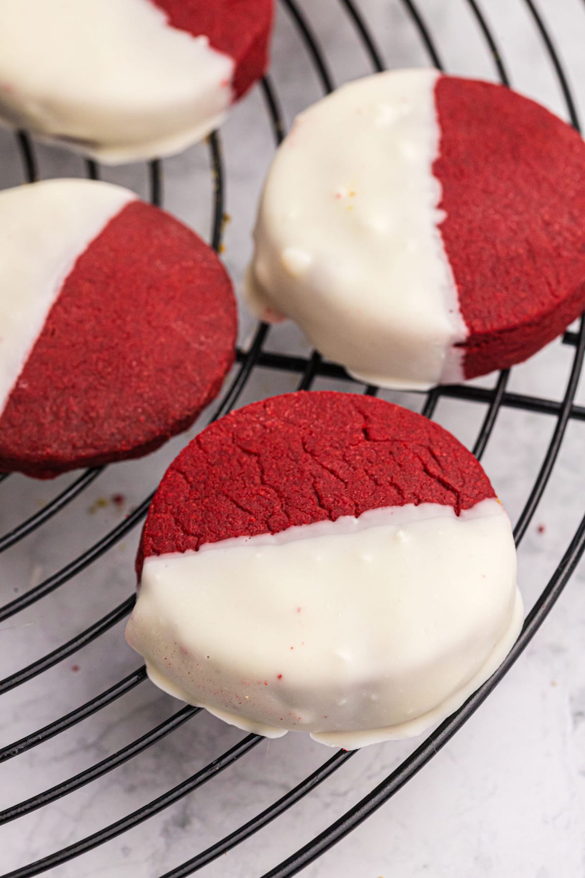 red velvet shortbread cookies dipped in white chocolate