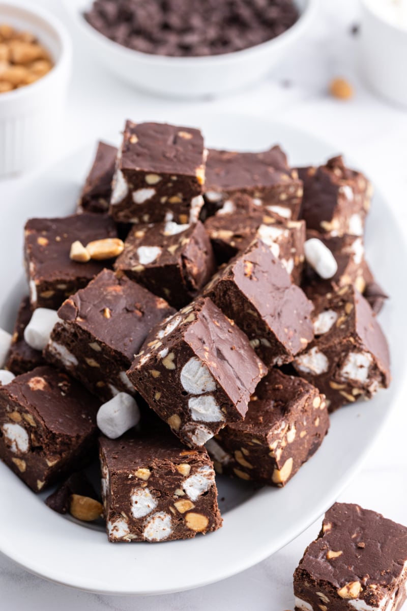 several pieces of rocky road fudge on a white platter