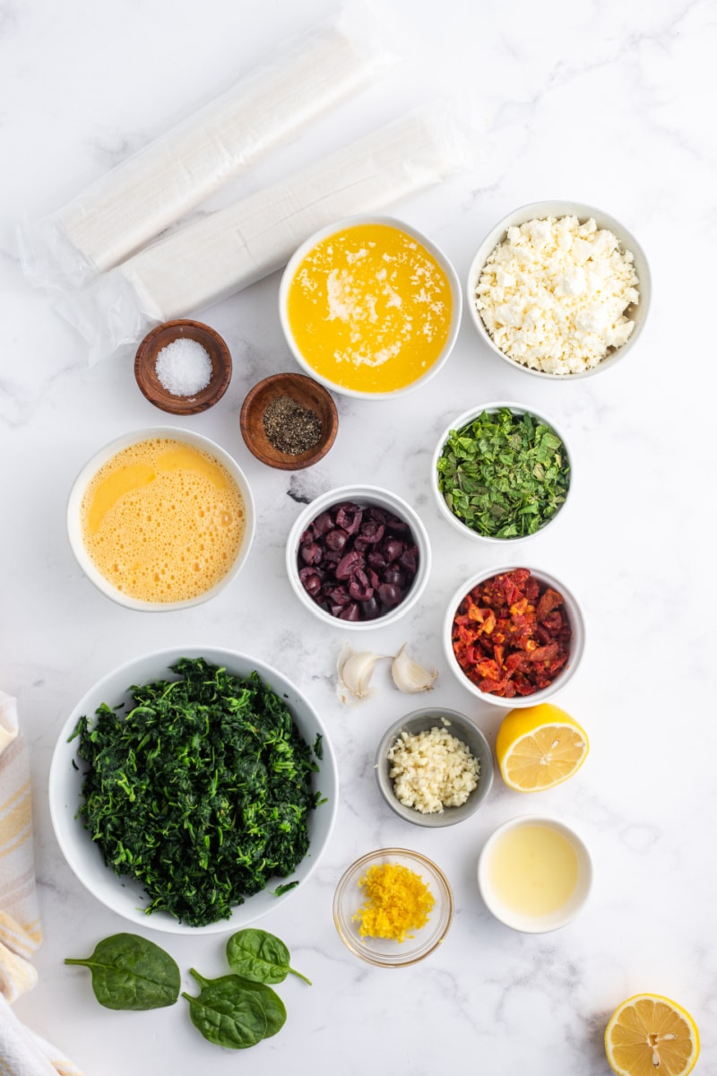 ingredients displayed for making spinach feta and sundried tomato phyllo triangles