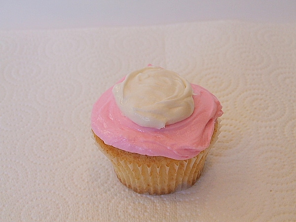 pink and white frosted cupcake