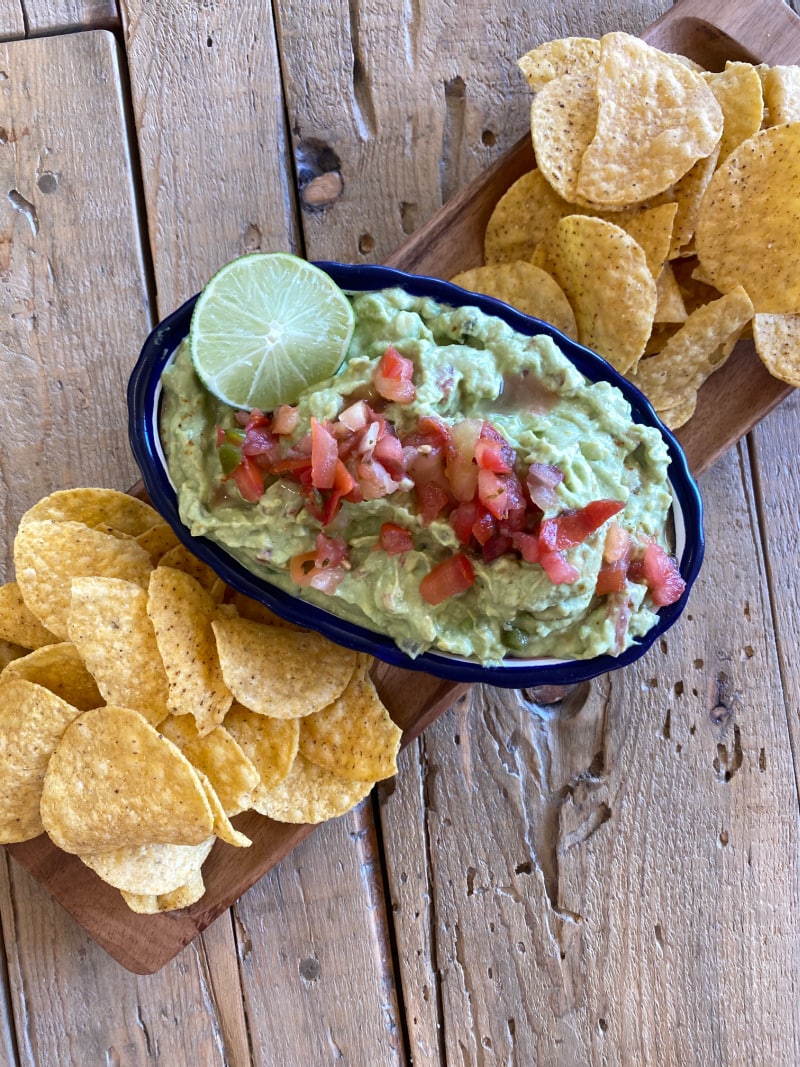 guacamole in a bowl with chips