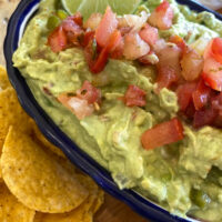 guacamole in a bowl with chips